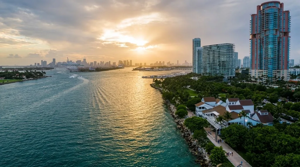 Aerial view at sunset of the southern tip of Miami Beach, with the bay, the port and the downtown Miami skyline beyond
