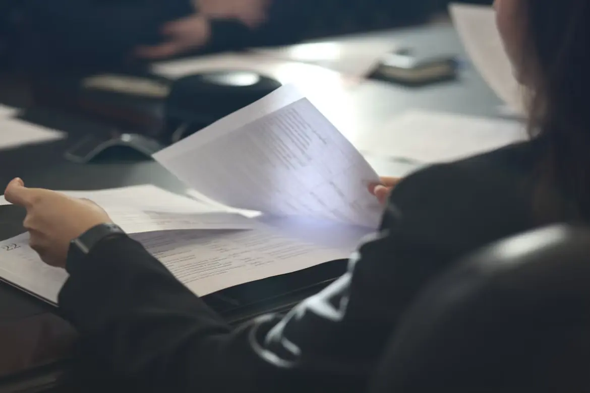 A person reviews a document in an office