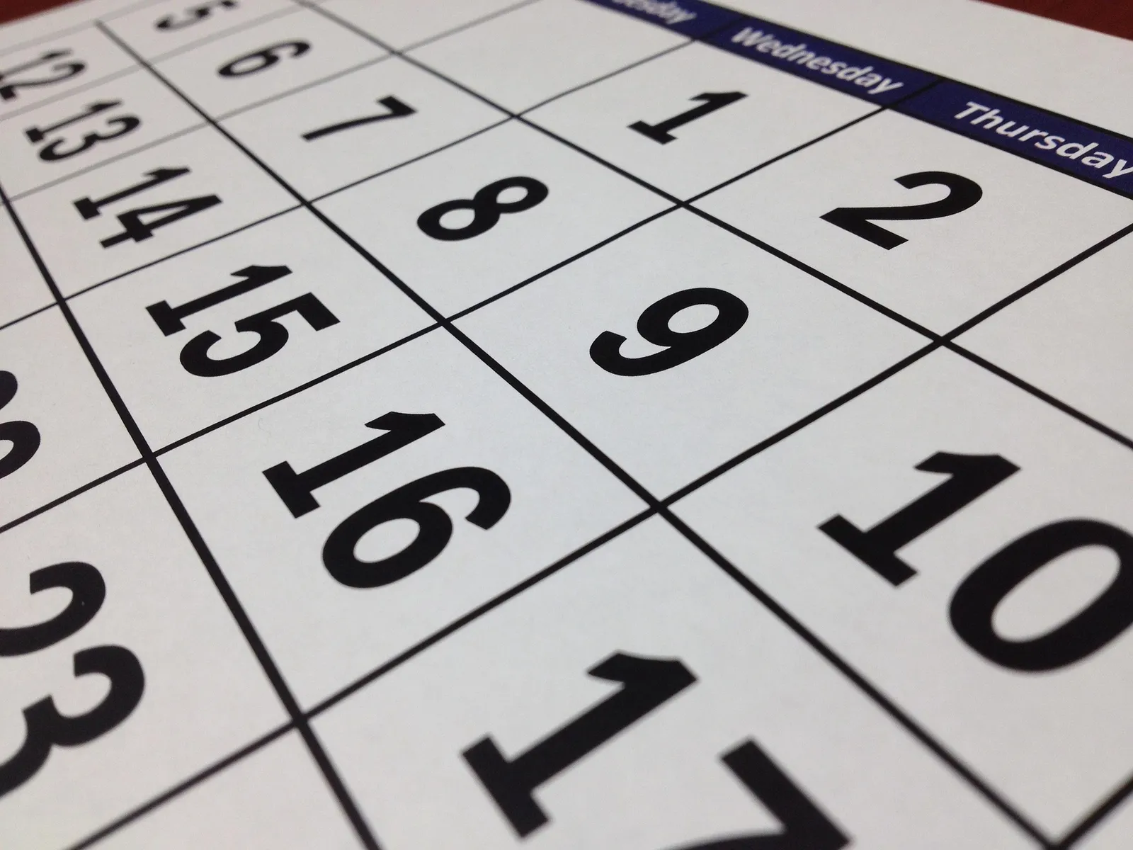 Close-up of a paper calendar showing the dates